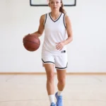 Women’s Retro basketball jersey and shorts in White and Black, court styling view