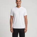Man wearing the white Hawk Evolution Soccer Jersey in a studio portrait.