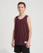 Youth B Core Reversbile Basketball Jersey worn by a model