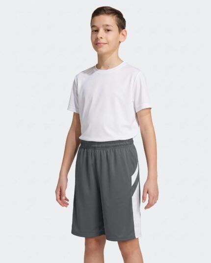 Youth B Pivot Reversible Basketball Shorts worn by a model