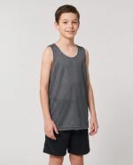 Youth Mesh Reversible Basketball Jersey worn by a model