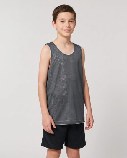 Youth Mesh Reversible Basketball Jersey worn by a model