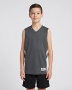 Youth B Pivot Reversible Basketball Jersey worn by a model