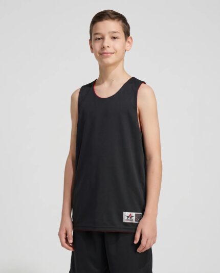 Youth Microfiber Reversible Basketball Jersey worn by a model