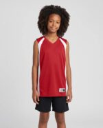 Youth Double Ply Reversible Basketball Jersey worn by a model