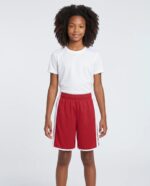 Youth Cross Over Reversible Basketball Shorts worn by a model