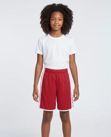 Youth Cross Over Reversible Basketball Shorts worn by a model