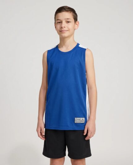 Youth Swish Reversible Basketball Jersey worn by a model